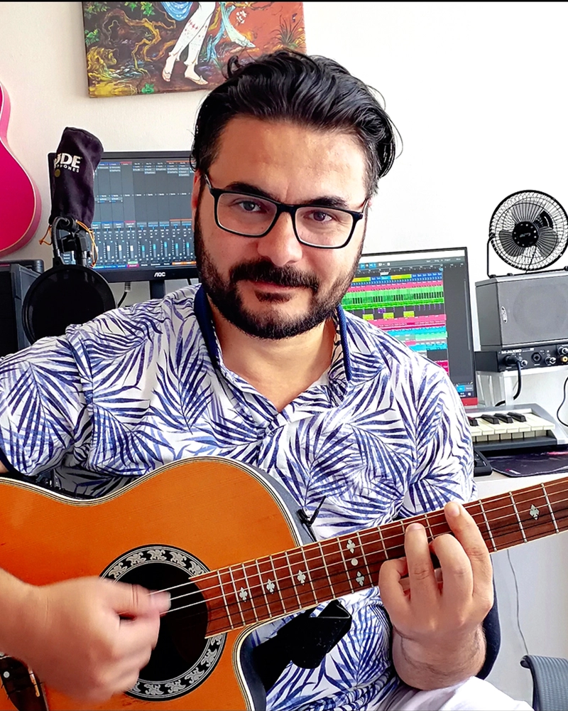 Berk Köksal in his home music studio